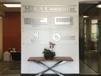 Brushed Aluminum Dimensional Letter Signs mounted on Clear Acrylic Panels with Brushed Aluminum Stand Off Hardware