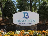 Custom Monument Sign with Brick Base and Dimensional Acrylic Graphics