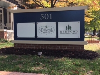 REDWOOD PROPERTIES MONUMENT SIGN - CLOSEUP