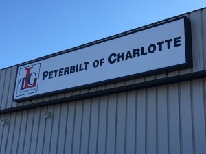 Exterior Lightbox Sign with Embossed Faces and Internal LED Illumination for Peterbilt of Charlotte
