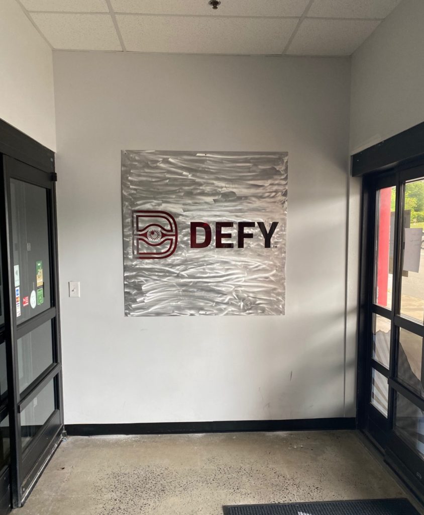 Defy Gravity -- Interior Lobby Sign