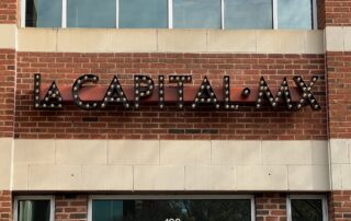 Open-Faced Channel Letters with Exposed Light Bulbs - Mounted on Raceway [JC Signs for La Capital MX of Charlotte]